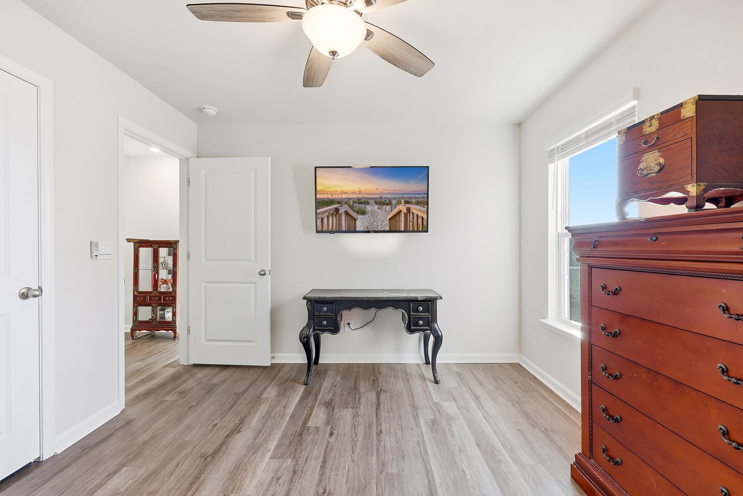 308 Picnic Basket Place Longs, SC 29568 - Photo 27 of 40 Bedroom featuring light wood-type flooring and a ceiling fan