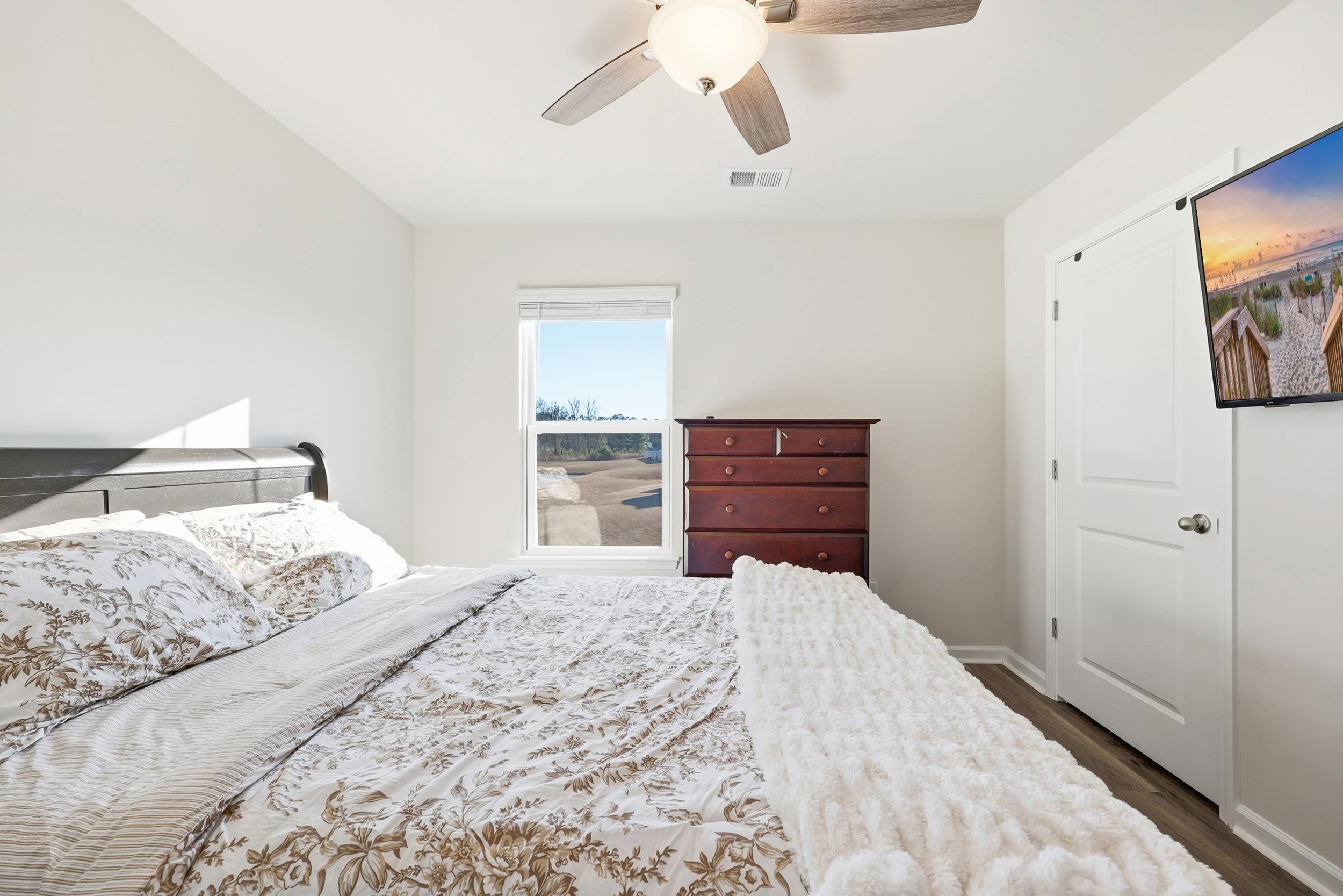 308 Picnic Basket Place Longs, SC 29568 - Photo 32 of 40 Bedroom featuring a ceiling fan and wood finished floors