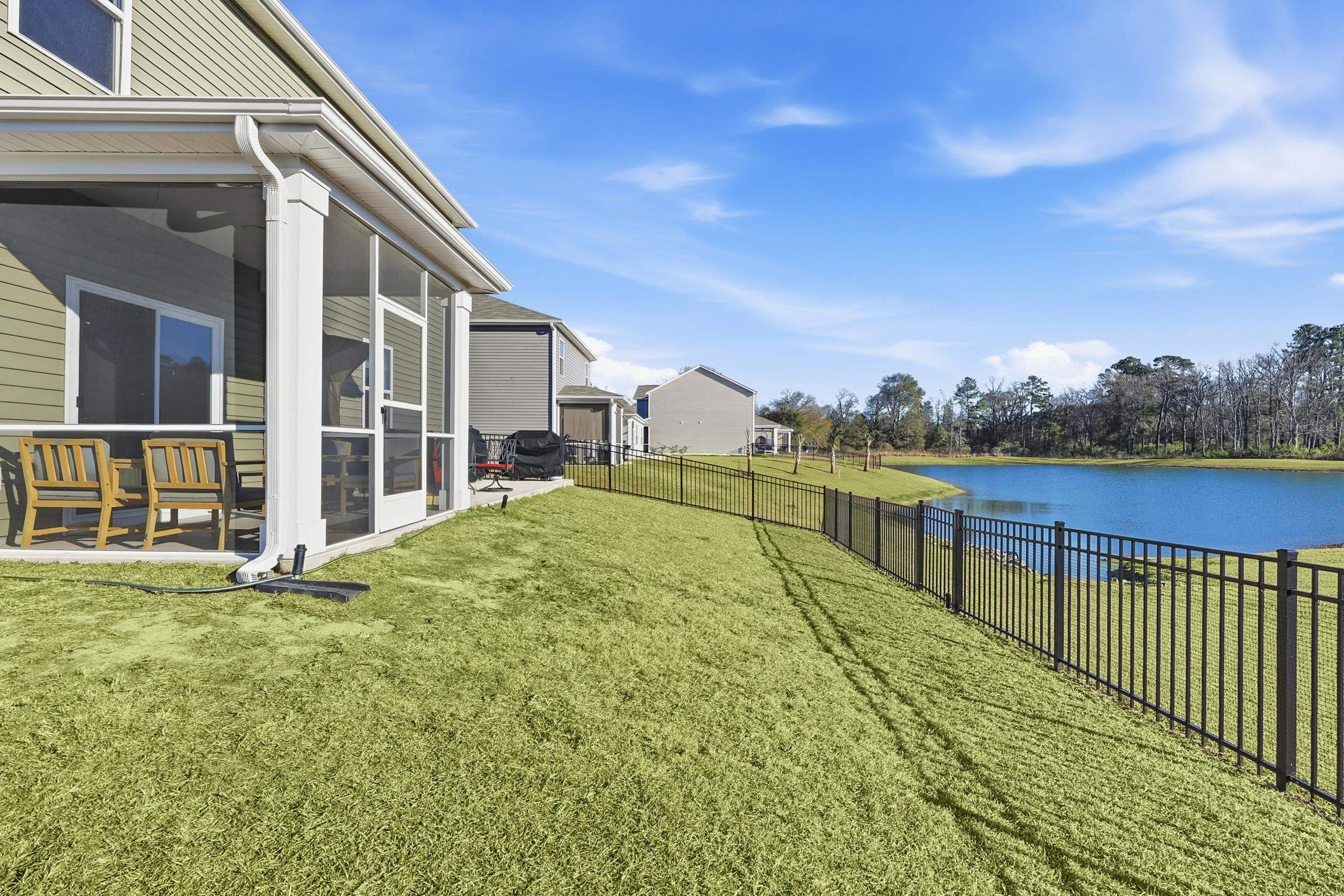 308 Picnic Basket Place Longs, SC 29568 - Photo 35 of 40 Fenced backyard featuring a water view and a sunroom