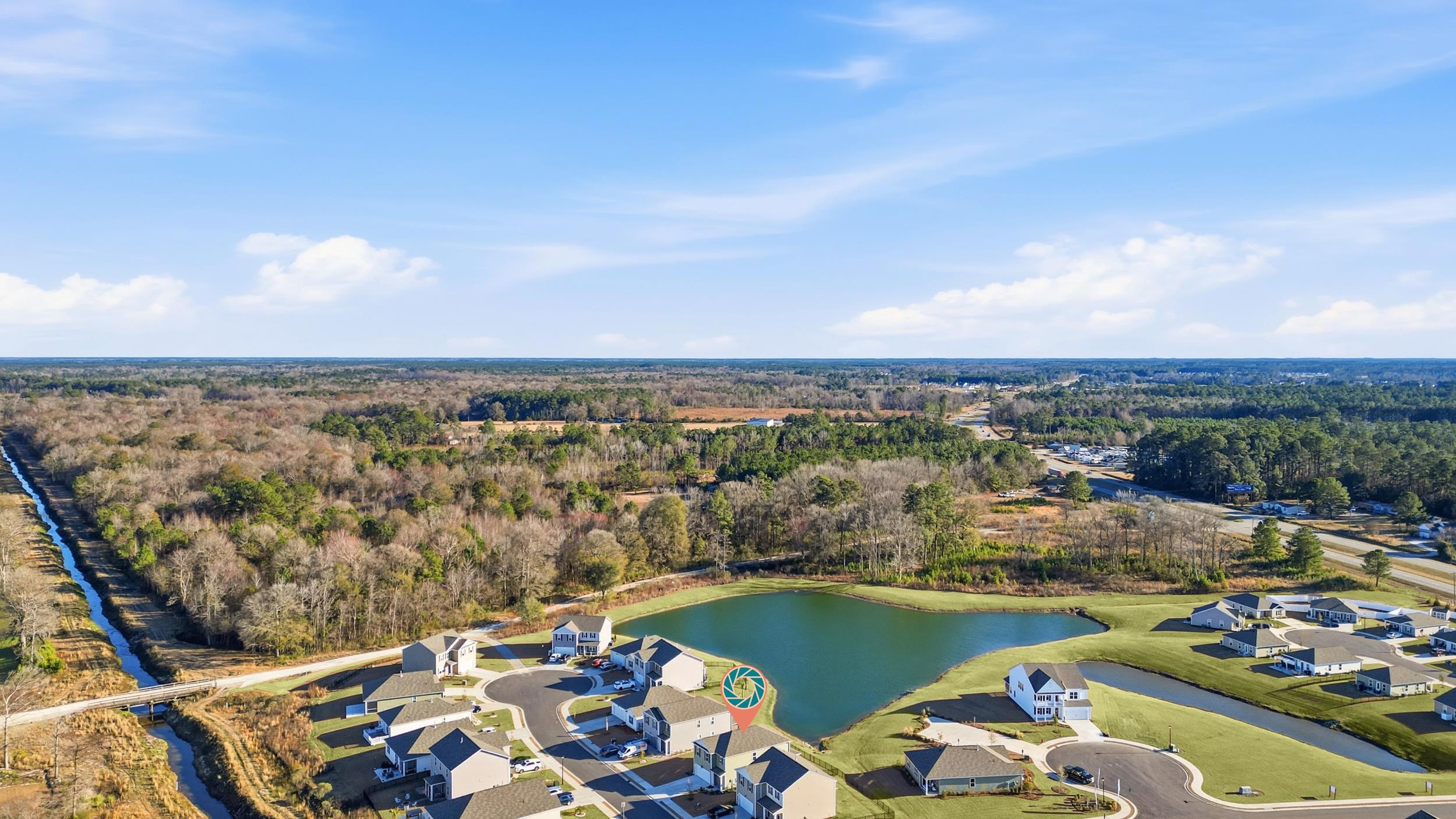 308 Picnic Basket Place Longs, SC 29568 - Photo 36 of 40 Aerial perspective of suburban area featuring a forest and a nearby body of water