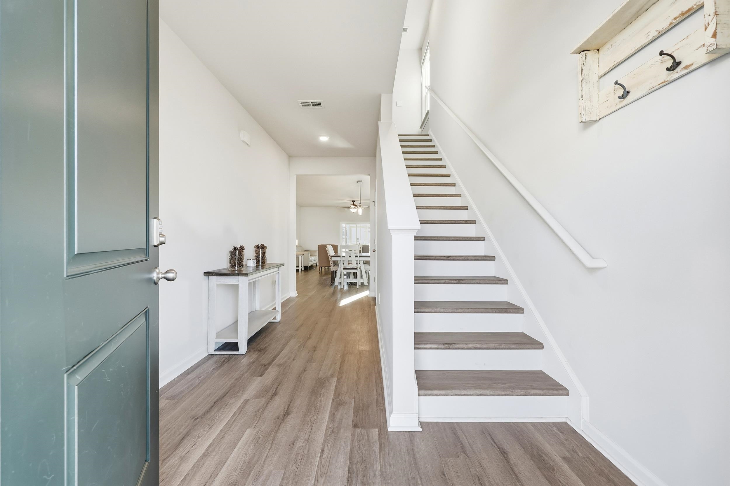 308 Picnic Basket Place Longs, SC 29568 - Photo 7 of 40 Foyer with stairway, light wood-style floors, and a ceiling fan