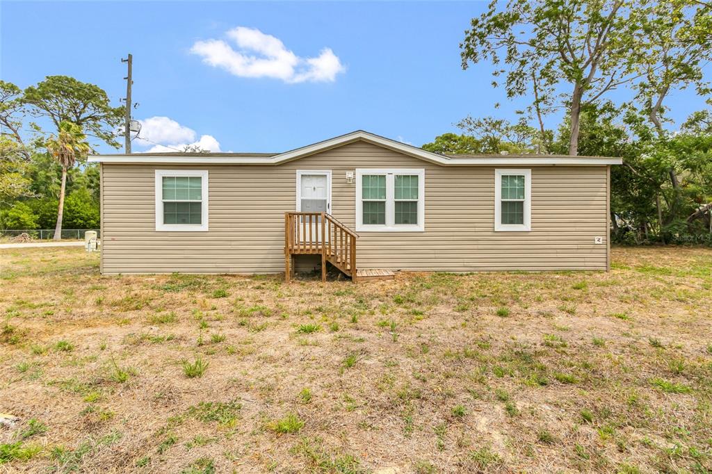 3264 Stephens Boulevard Spring Hill, FL 34606 - Photo 1 of 35 a front view of a house with a yard