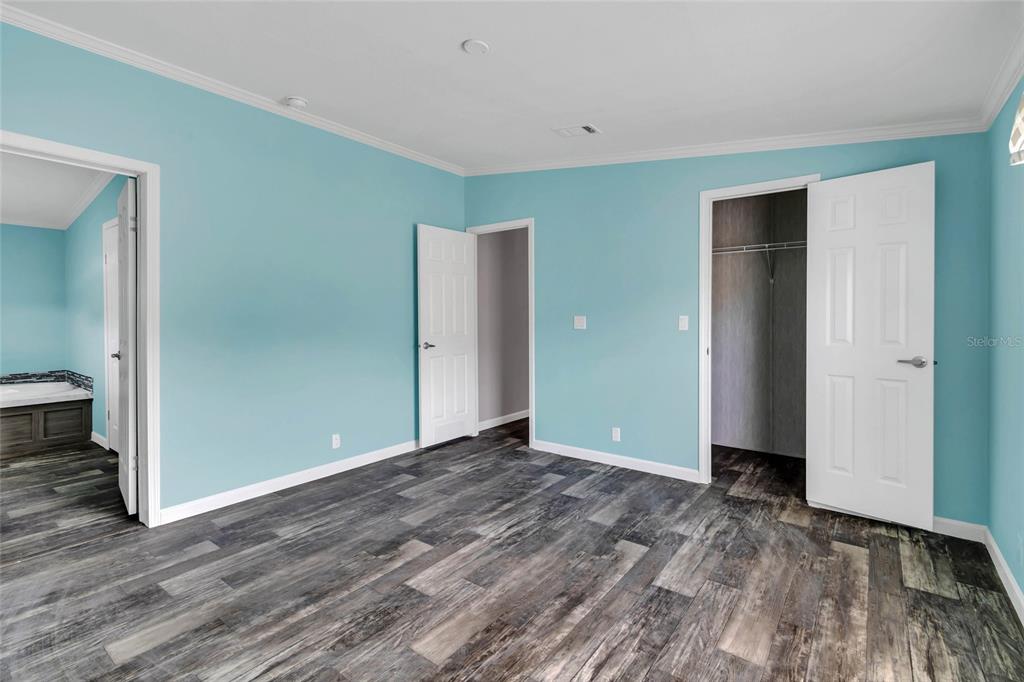 3264 Stephens Boulevard Spring Hill, FL 34606 - Photo 16 of 35 an empty room with wooden floor and closet