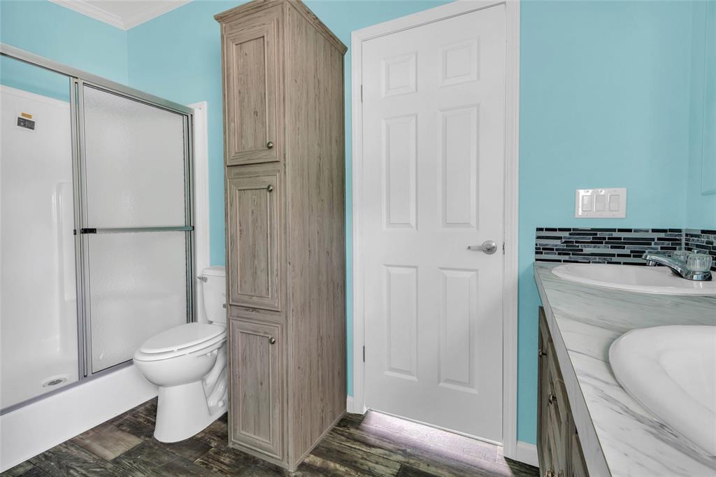 3264 Stephens Boulevard Spring Hill, FL 34606 - Photo 18 of 35 a bathroom with a toilet and a shower