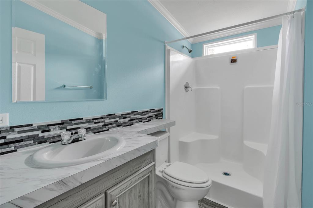 3264 Stephens Boulevard Spring Hill, FL 34606 - Photo 21 of 35 a bathroom with a sink toilet and shower