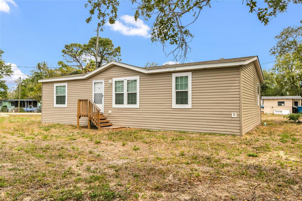 3264 Stephens Boulevard Spring Hill, FL 34606 - Photo 26 of 35 a front view of a house with a garden