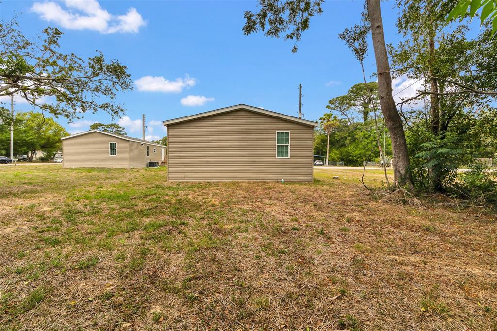 3264 Stephens Boulevard Spring Hill, FL 34606 - Photo 29 of 35 a view of a house with a yard
