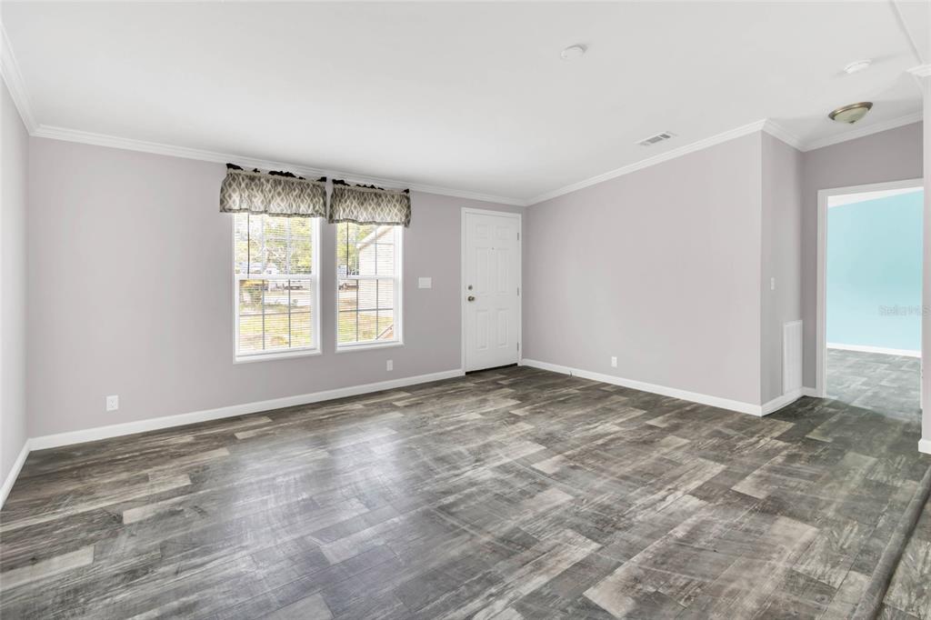 3264 Stephens Boulevard Spring Hill, FL 34606 - Photo 4 of 35 a view of an empty room with a window