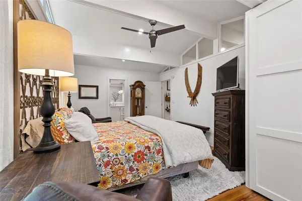 a bed room with a bed and a chair