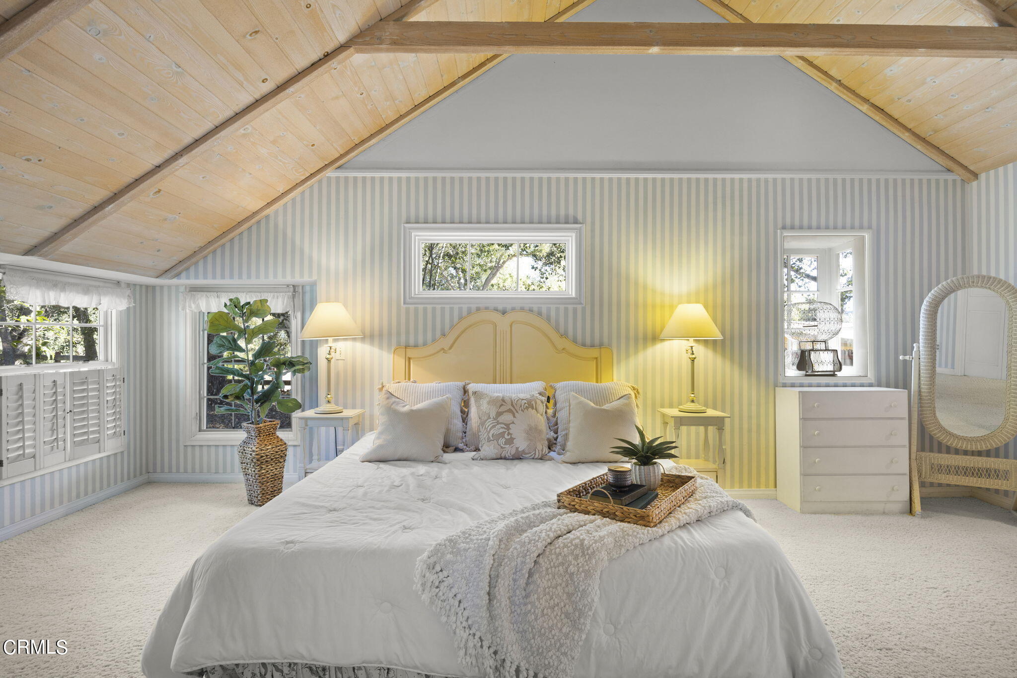 601 Foothill Road Ojai, CA 93023 - Photo 15 of 47 a bedroom with a bed and a chandelier