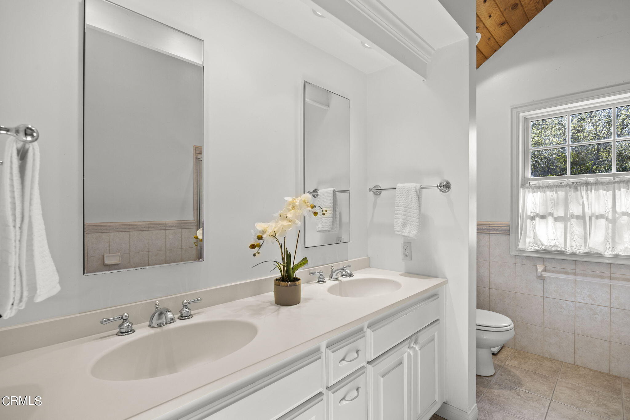 601 Foothill Road Ojai, CA 93023 - Photo 21 of 47 a bathroom with a sink double vanity and a mirror