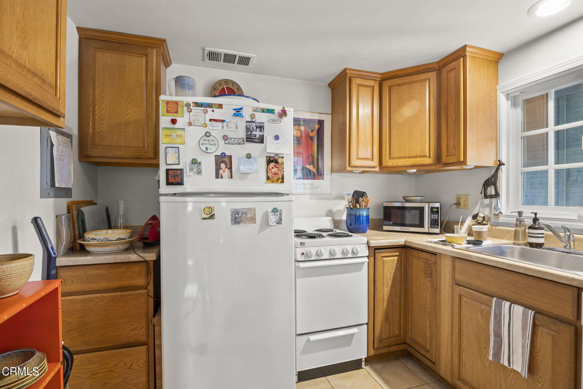 601 Foothill Road Ojai, CA 93023 - Photo 39 of 47 a view of a kitchen with sink and wooden cabinets