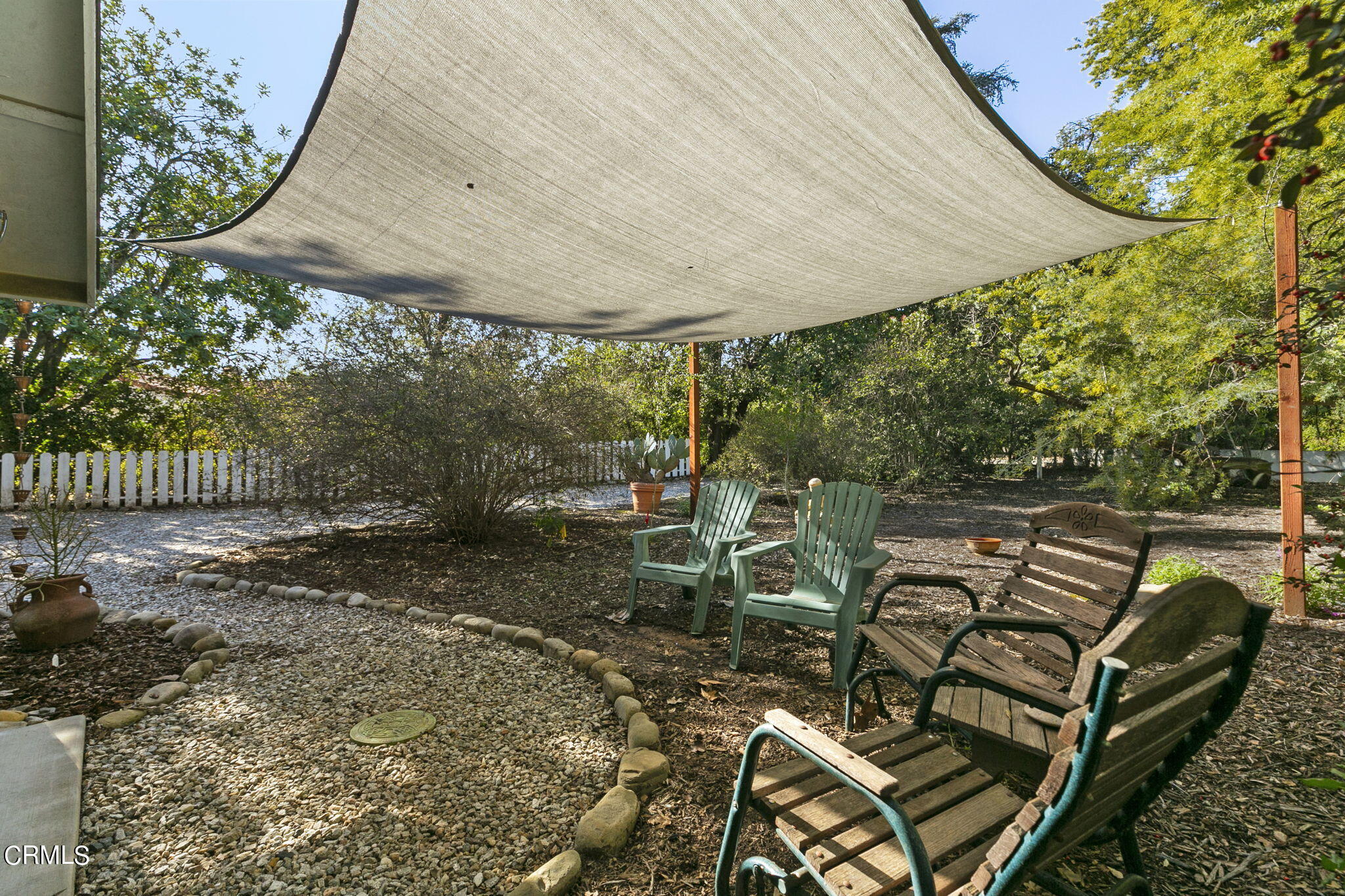 601 Foothill Road Ojai, CA 93023 - Photo 42 of 47 a backyard of a house with table and chairs