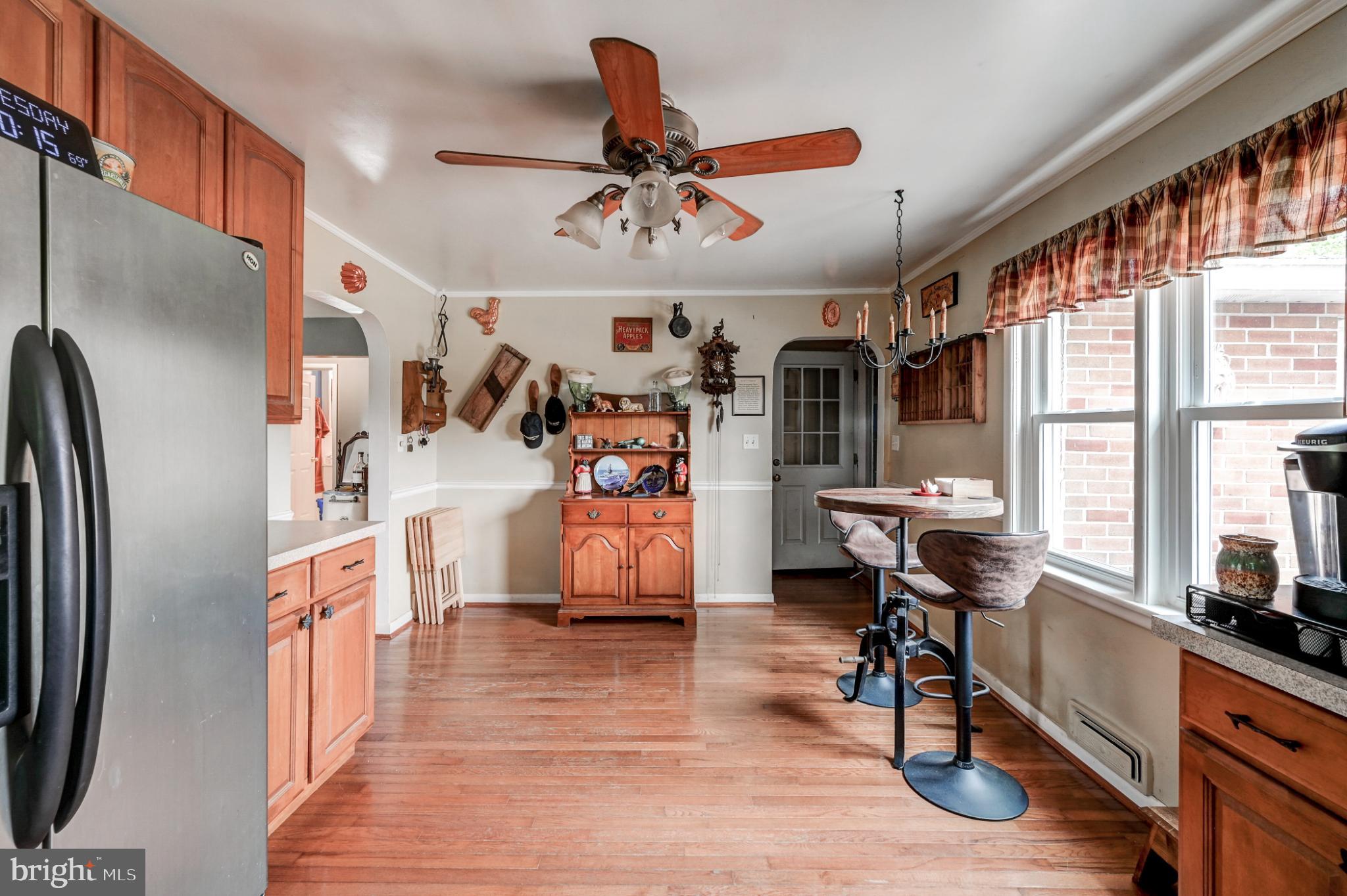 5371 Long Corner Road White Hall, MD 21161 - Photo 12 of 30 a view of a dining room with furniture window and wooden floor