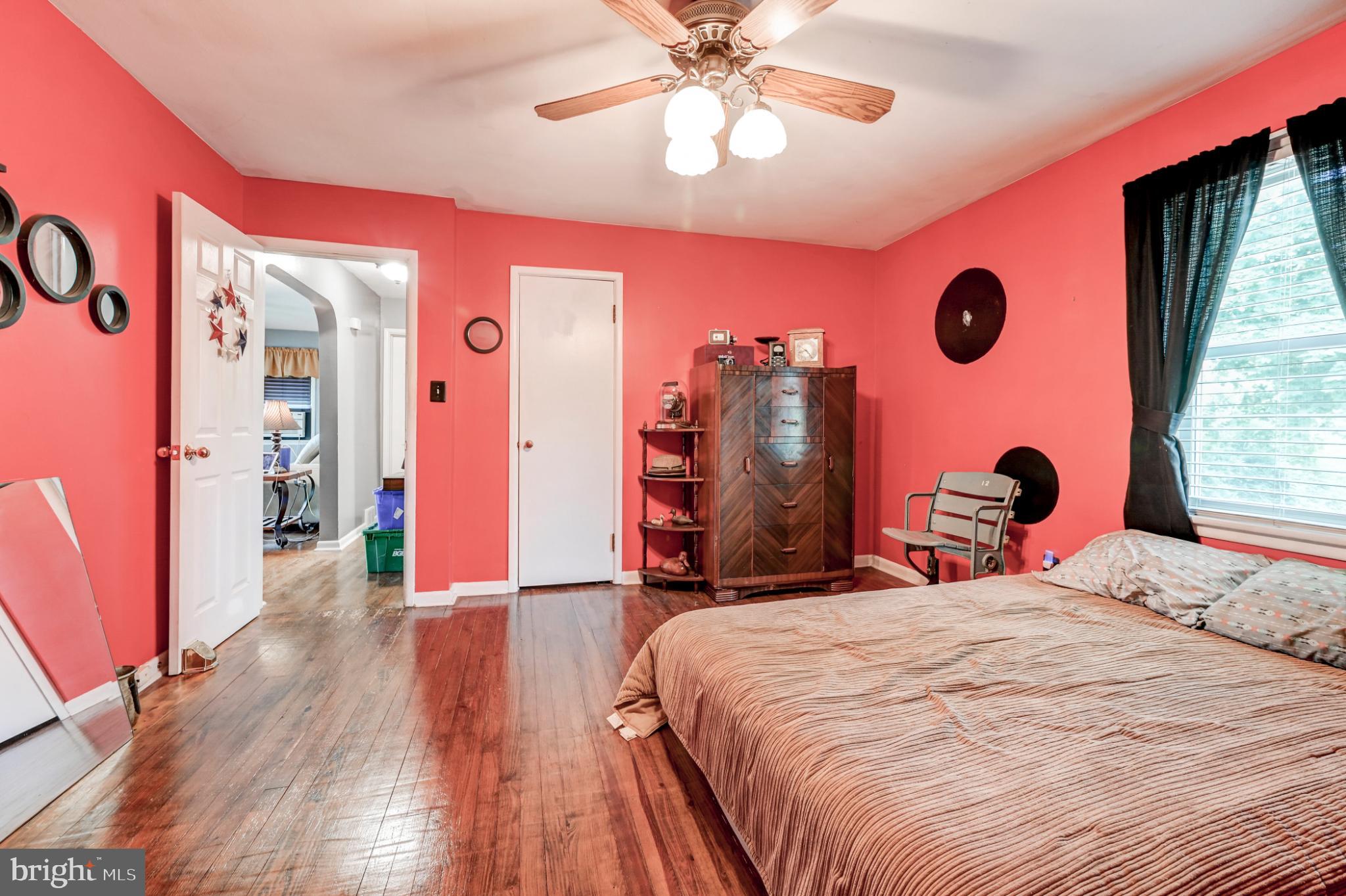 5371 Long Corner Road White Hall, MD 21161 - Photo 14 of 30 a bedroom with a bed and a chandelier