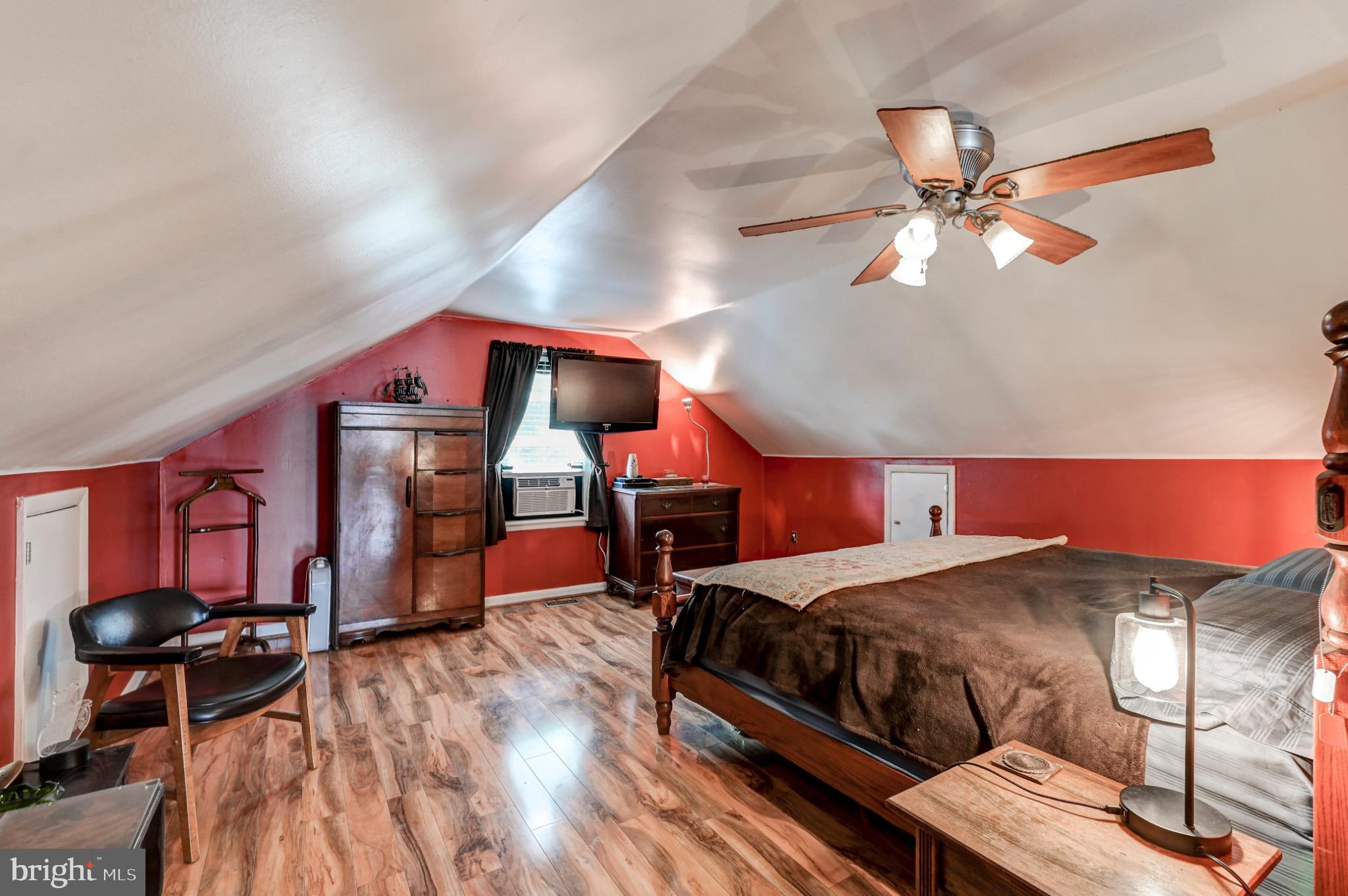 5371 Long Corner Road White Hall, MD 21161 - Photo 19 of 30 a bedroom with a bed and a chandelier