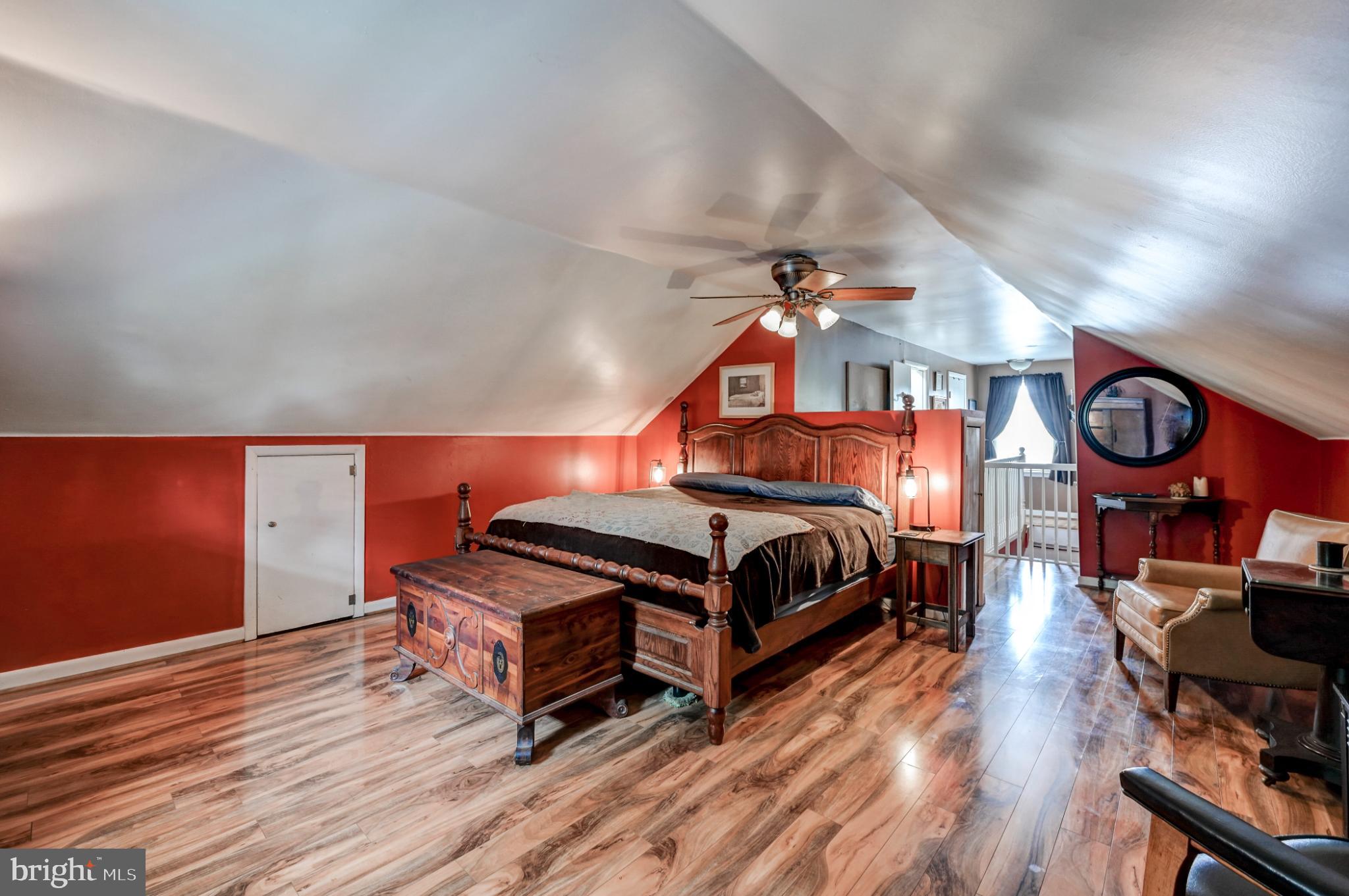 5371 Long Corner Road White Hall, MD 21161 - Photo 20 of 30 a bedroom with a bed and a chandelier