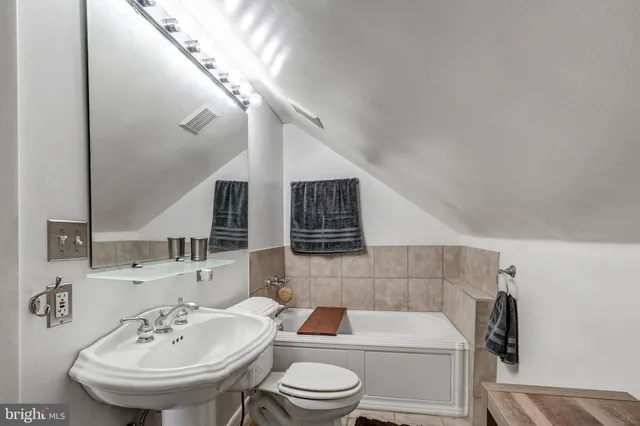 a room with table tennis and stairs