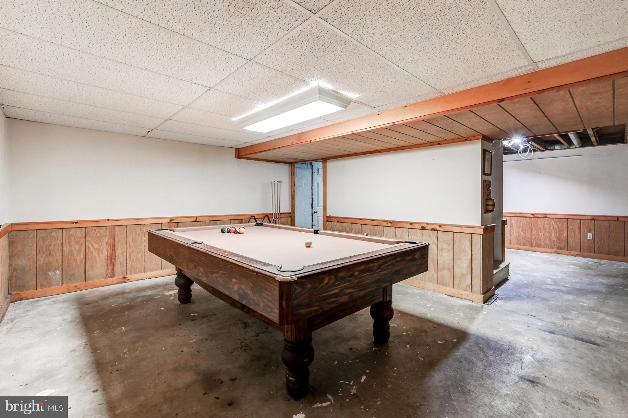 5371 Long Corner Road White Hall, MD 21161 - Photo 22 of 30 a room with table tennis and stairs