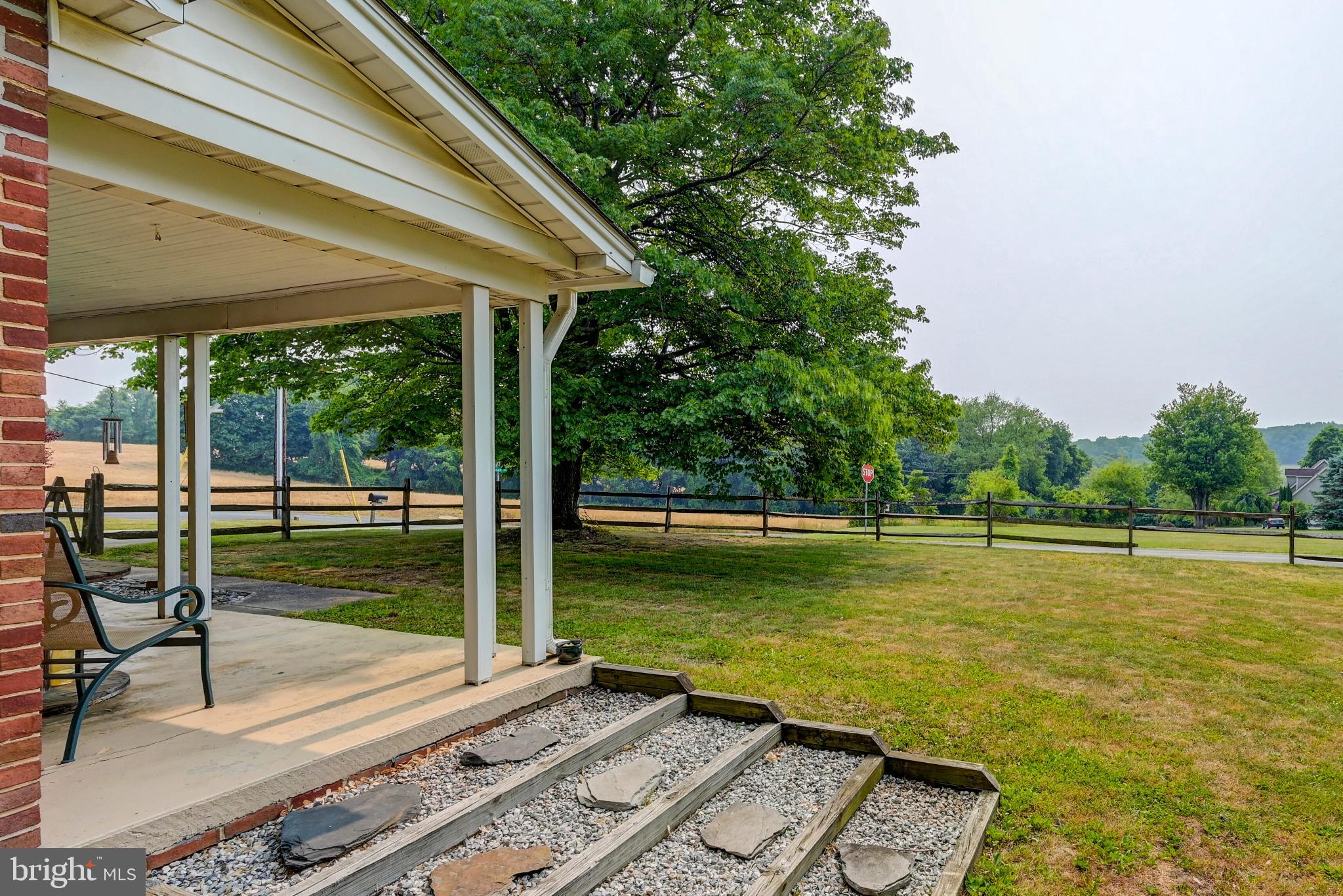5371 Long Corner Road White Hall, MD 21161 - Photo 29 of 30 a view of a pool with a table and chairs under an umbrella