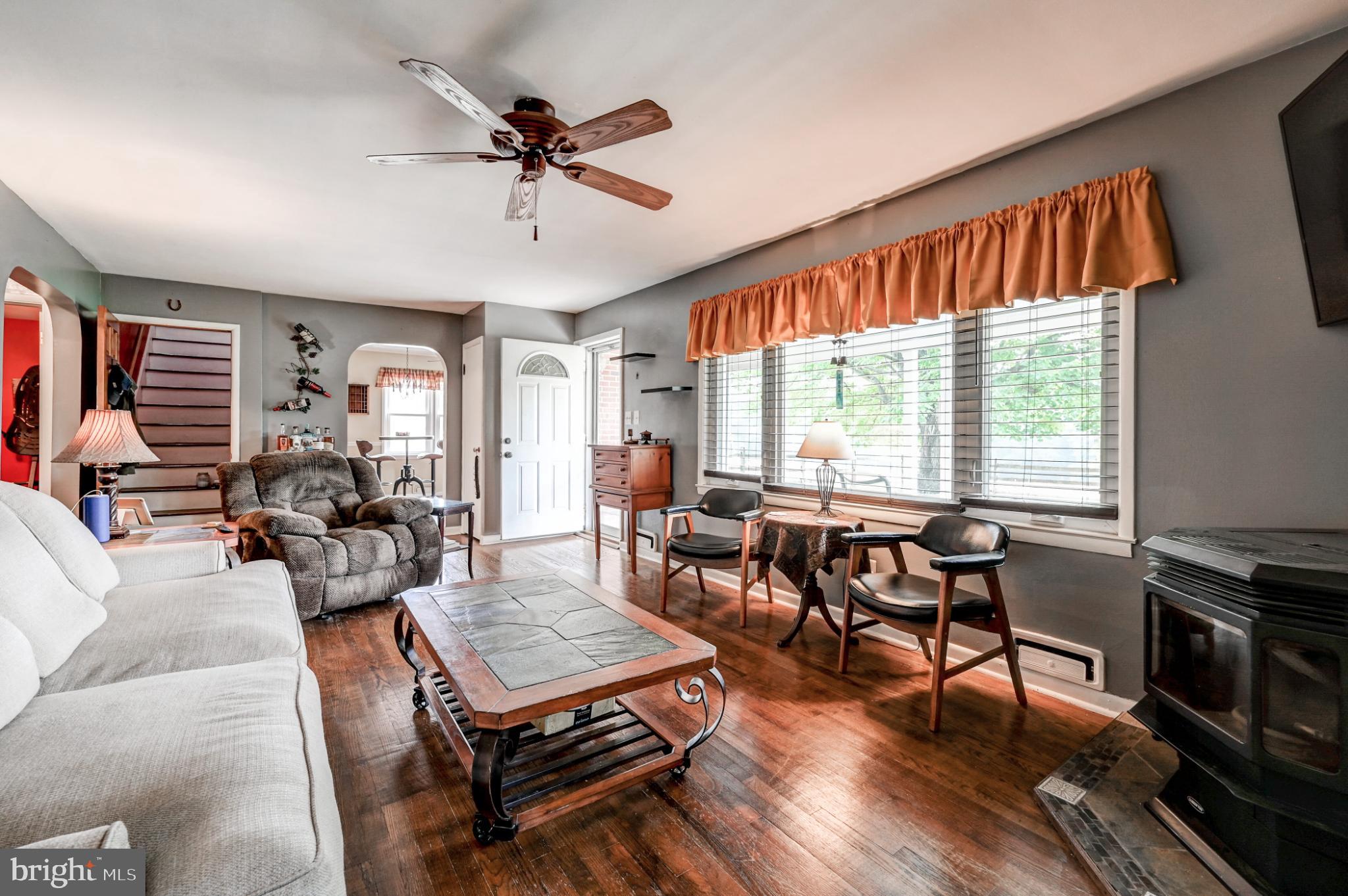 5371 Long Corner Road White Hall, MD 21161 - Photo 9 of 30 a living room with furniture a ceiling fan and a window