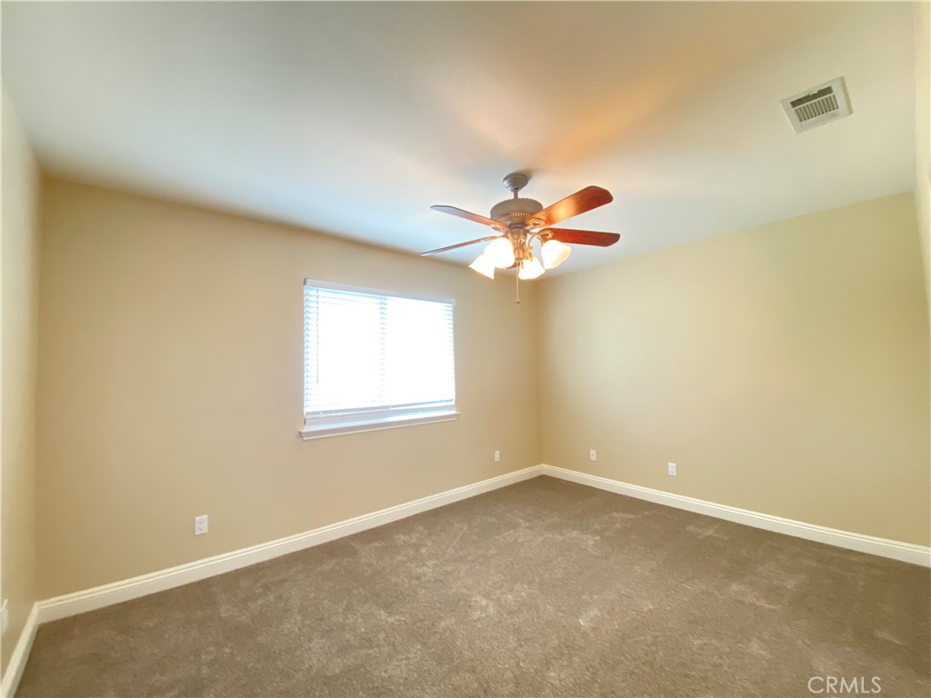 14670 Gilman Springs Road Moreno Valley, CA 92555 - Photo 20 of 50 an empty room with a window