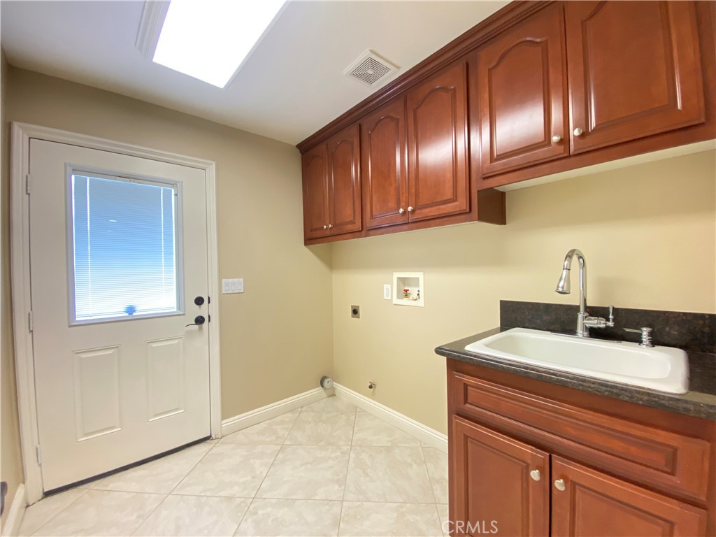 14670 Gilman Springs Road Moreno Valley, CA 92555 - Photo 31 of 50 a kitchen with a sink and cabinets