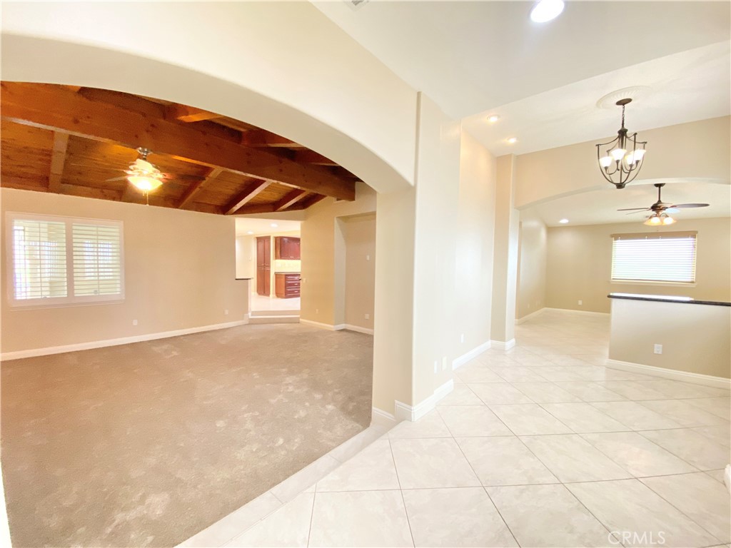 14670 Gilman Springs Road Moreno Valley, CA 92555 - Photo 5 of 50 a view of a kitchen with a sink and refrigerator
