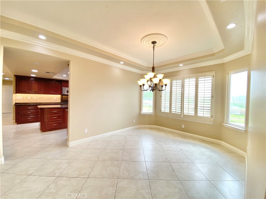 14670 Gilman Springs Road Moreno Valley, CA 92555 - Photo 8 of 50 a view of an empty room with a kitchen
