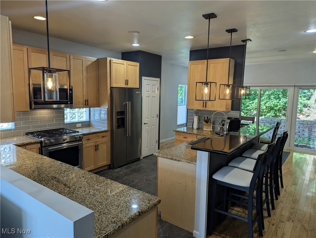 1949 Columbus Road Cleveland, OH 44113 - Photo 7 of 25 Kitchen with breakfast bar