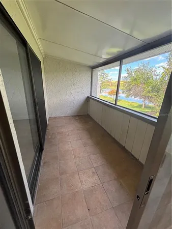 a view of an empty room with a window