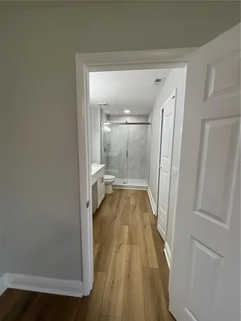 a view of a bathroom from a hallway