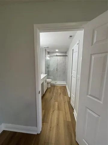a view of a bathroom from a hallway