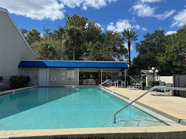 a front view of house with yard and outdoor seating