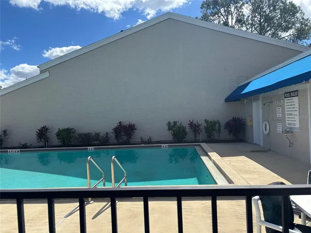 a view of swimming pool from a balcony