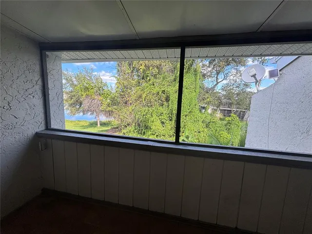 a view of a room with a large window