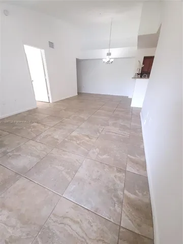 a view of a room with an empty space