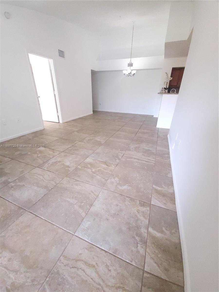 2133 Renaissance Boulevard, Unit 306 Miramar, FL 33025 - Photo 2 of 41 a view of a room with an empty space