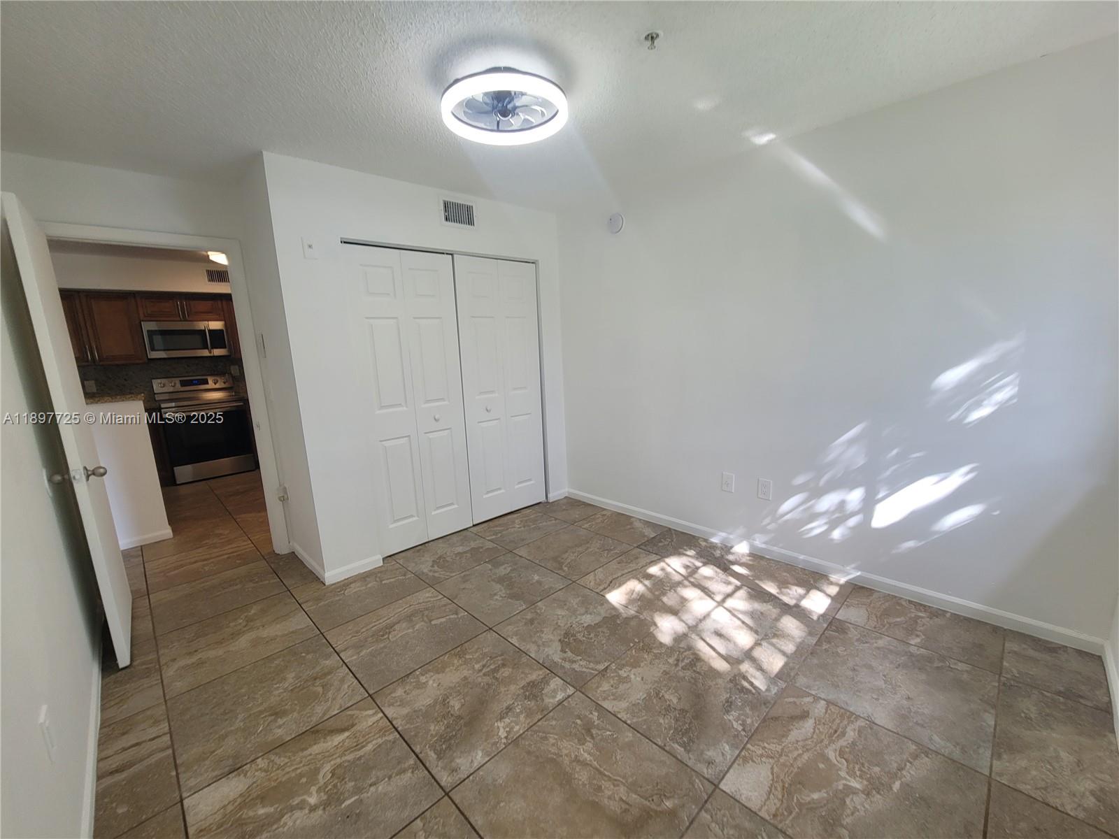 2133 Renaissance Boulevard, Unit 306 Miramar, FL 33025 - Photo 21 of 41 a view of a hallway