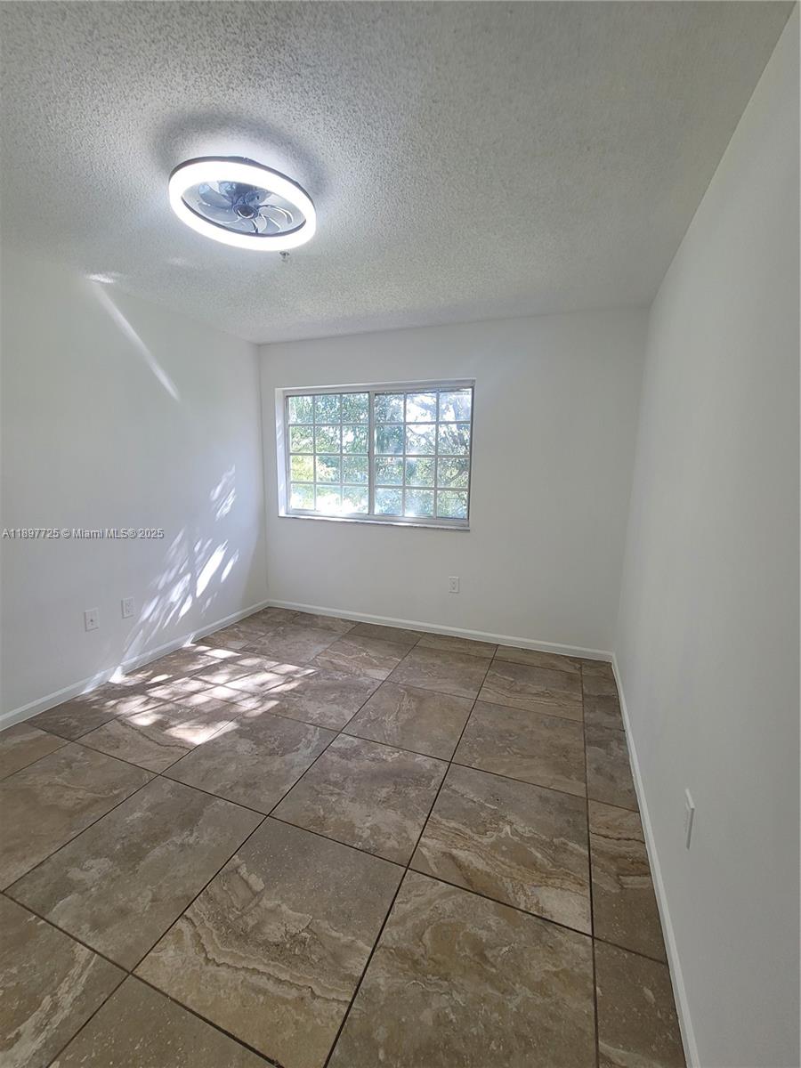 2133 Renaissance Boulevard, Unit 306 Miramar, FL 33025 - Photo 24 of 41 a view of livingroom with window