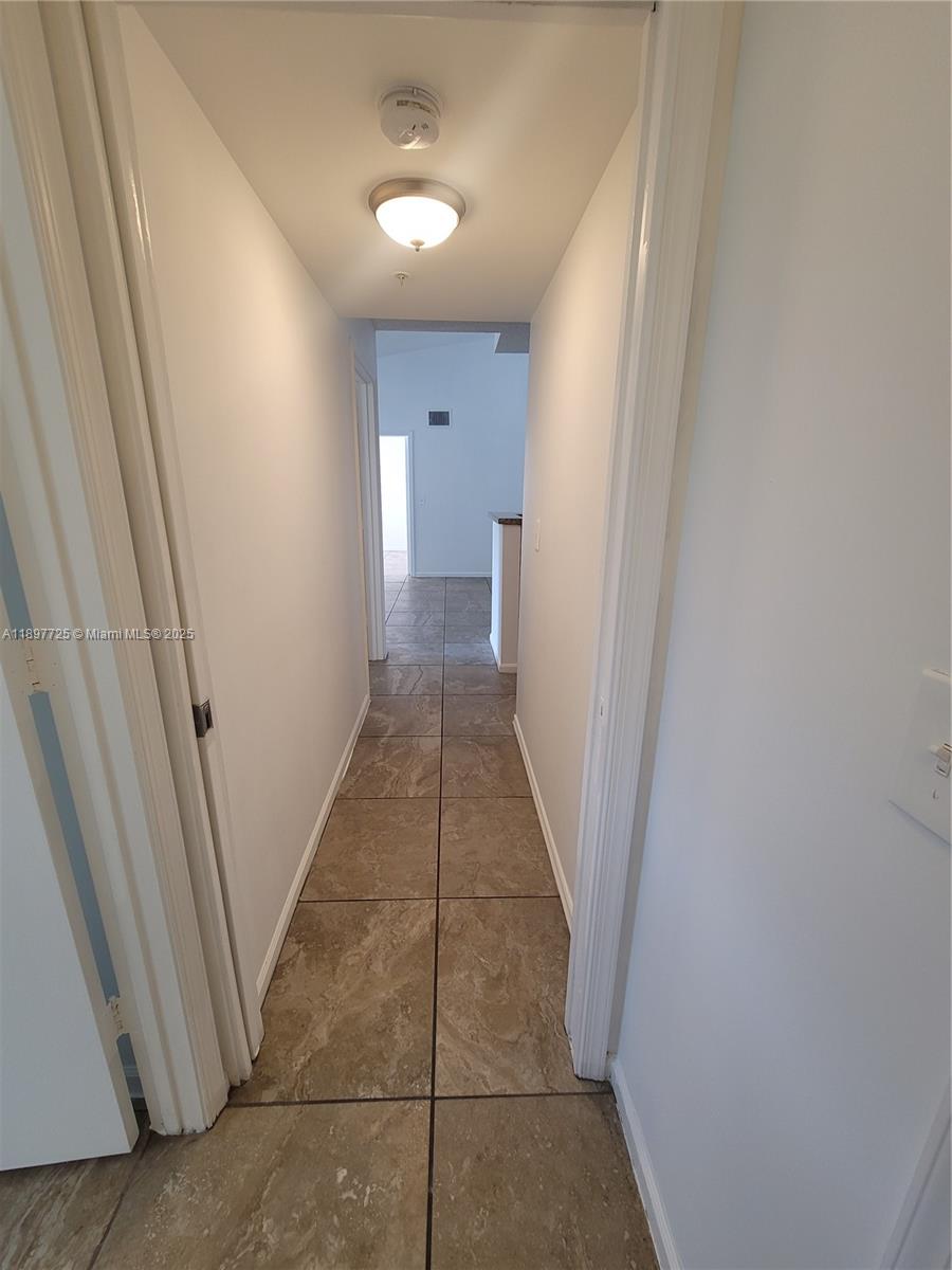 2133 Renaissance Boulevard, Unit 306 Miramar, FL 33025 - Photo 28 of 41 a view of a hallway