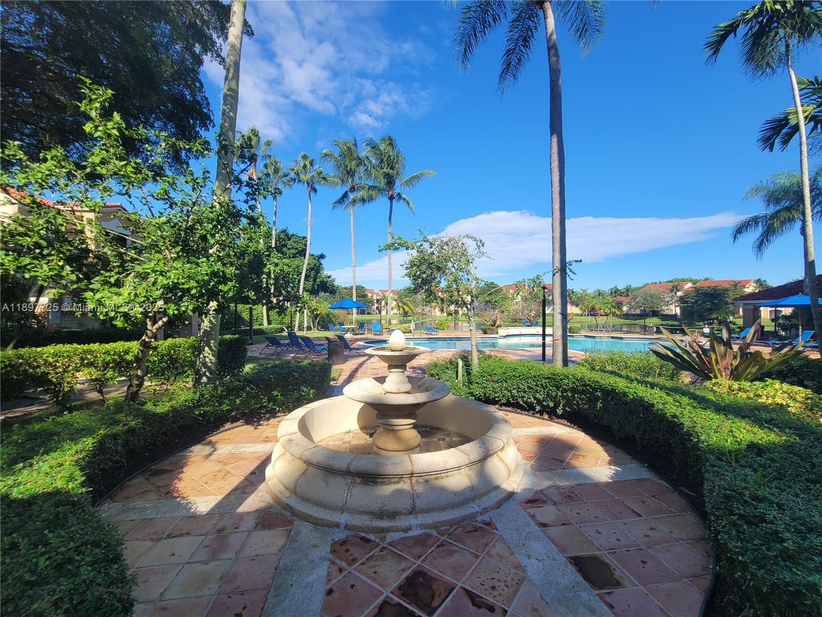 2133 Renaissance Boulevard, Unit 306 Miramar, FL 33025 - Photo 34 of 41 a view of a fountain in the garden