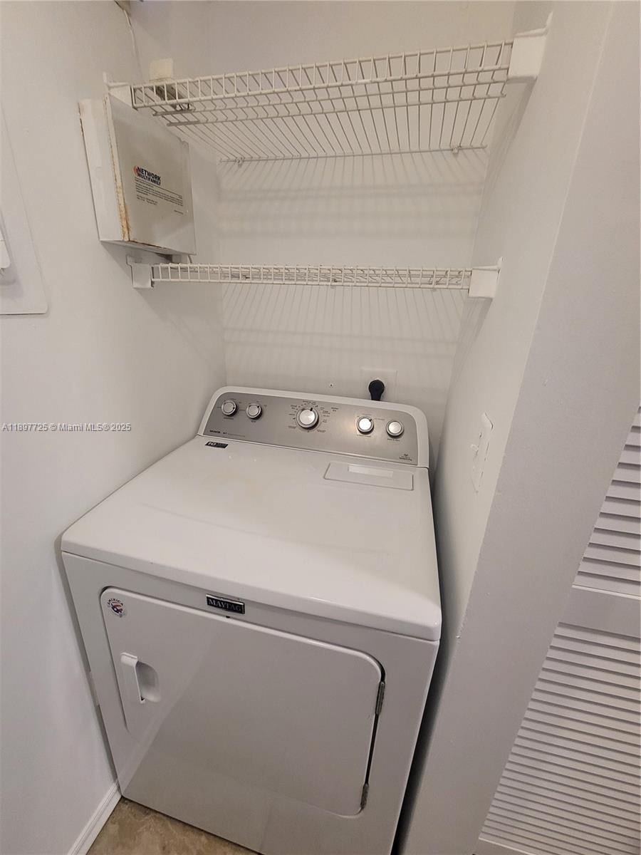 2133 Renaissance Boulevard, Unit 306 Miramar, FL 33025 - Photo 41 of 41 a utility room with dryer and washer
