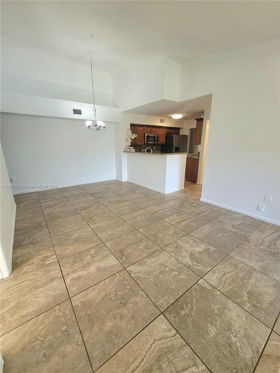 2133 Renaissance Boulevard, Unit 306 Miramar, FL 33025 - Photo 10 of 41 a view of a room with a garage