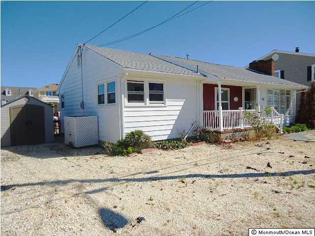 208 Heron Road Lavallette, NJ 08735 - Photo 1 of 11 a front view of a house with a yard