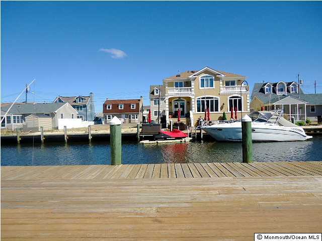 208 Heron Road Lavallette, NJ 08735 - Photo 4 of 11 a view of a swimming pool and lounge chair
