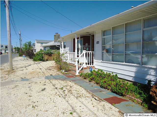 208 Heron Road Lavallette, NJ 08735 - Photo 7 of 11 a front view of a house with a yard