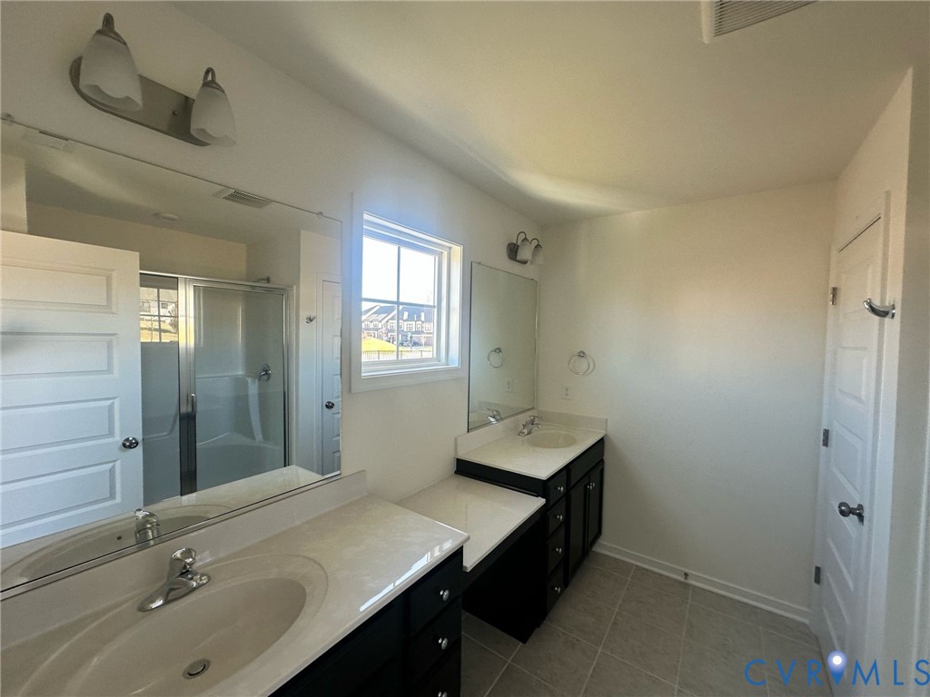 12737 Deep Wl Road Midlothian, VA 23112 - Photo 11 of 17 a bathroom with a sink a toilet and mirror