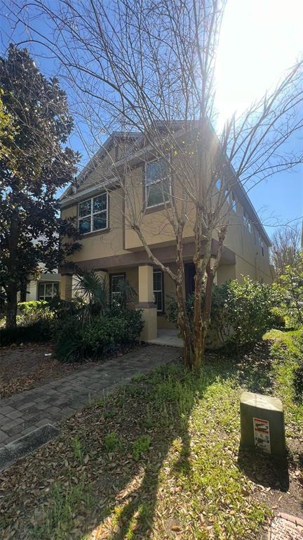 10604 Reams Road Windermere, FL 34786 - Photo 1 of 1 a front view of a house with garden