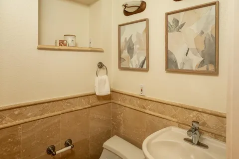 a bathroom with a toilet sink